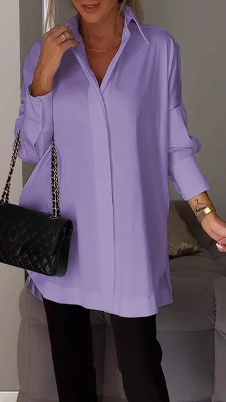 Elegante oversized overhemdblouse met opgerolde mouwen