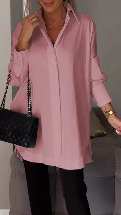 Elegante oversized overhemdblouse met opgerolde mouwen