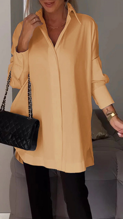 Elegante oversized overhemdblouse met opgerolde mouwen